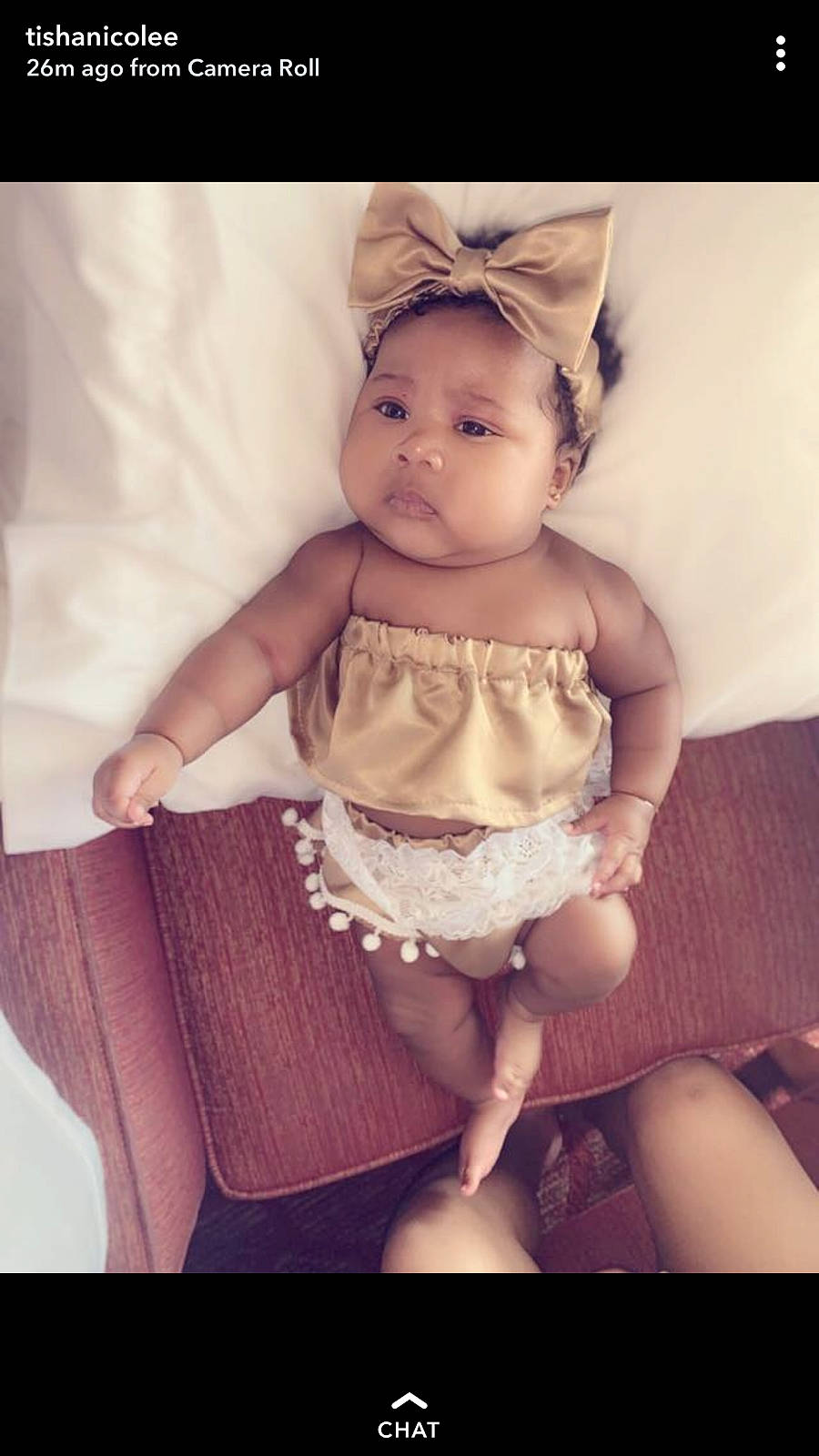 Ivy is registered to the contest to win money with this photo: baby, beauty, cheek, child, dress, eye, face, facial_expression, head, headgear, headwear, iris, leg, people, person, photograph, photography, sitting, skin, smile