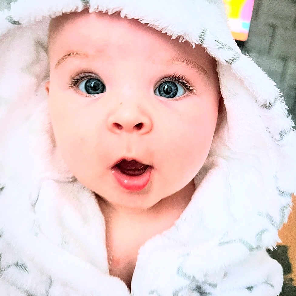 Kali joined the competition — help win amazing prizes! baby, blanket, bodypart, bonnet, cap, clothing, face, hat, head, hood, hoodie, knitwear, mouth, newborn, person, photography, portrait, sweater, sweatshirt, towel