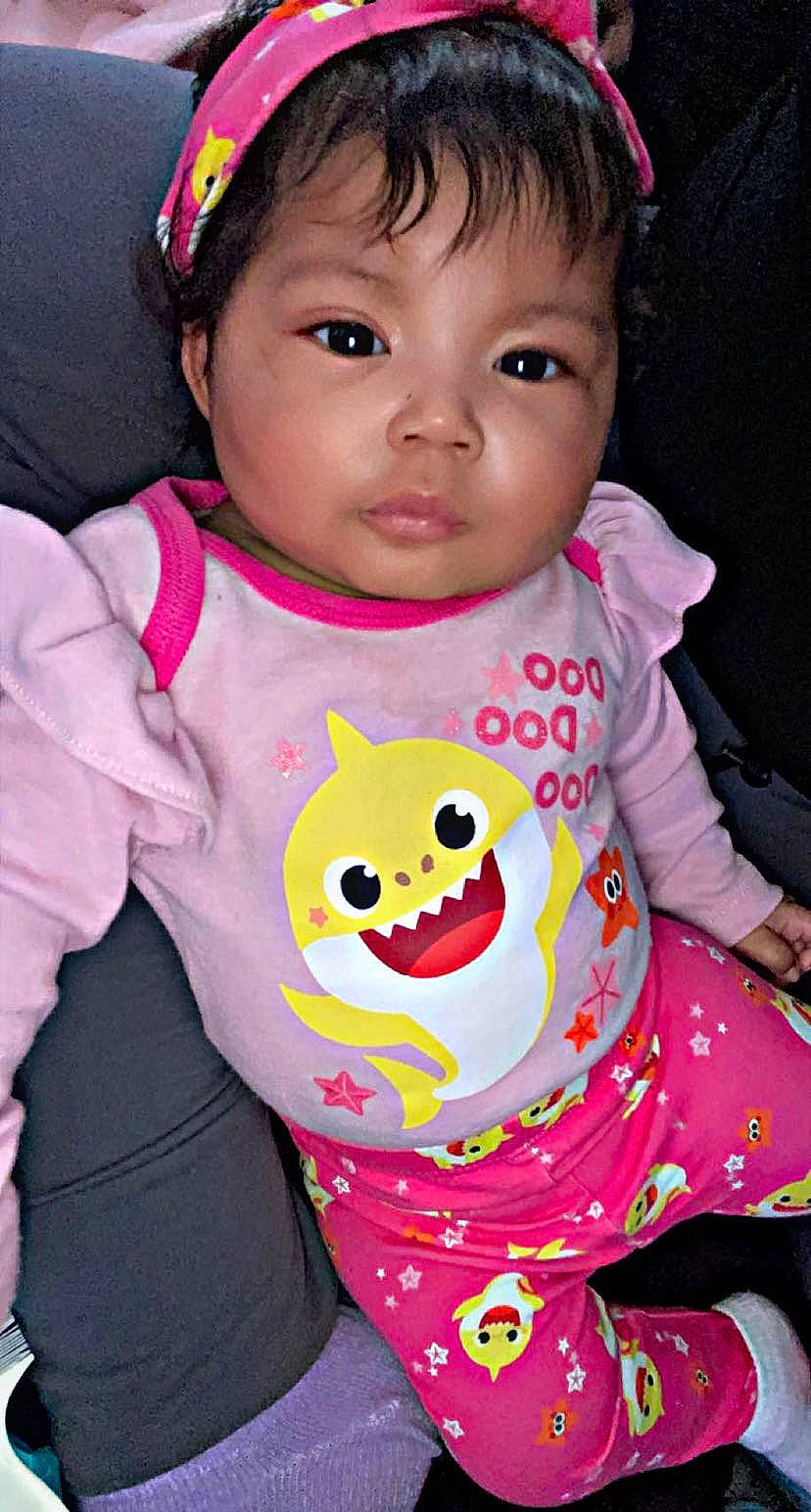 Masani is registered to the contest to win money with this photo: baby_toddler_clothing, black, cheek, child, cool, eyelash, face, facial_expression, green, happy, head, lip, neck, organ, outerwear, person, pink, skin, sleeve, toddler