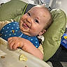 Moraya is registered to the contest to win money with this photo: baby, high_chair, bib, messy_face, food, smiling, tongue_out, indoor, stairs, home, child, face, eating, cute, happy, clothing, person, seat, table, funny