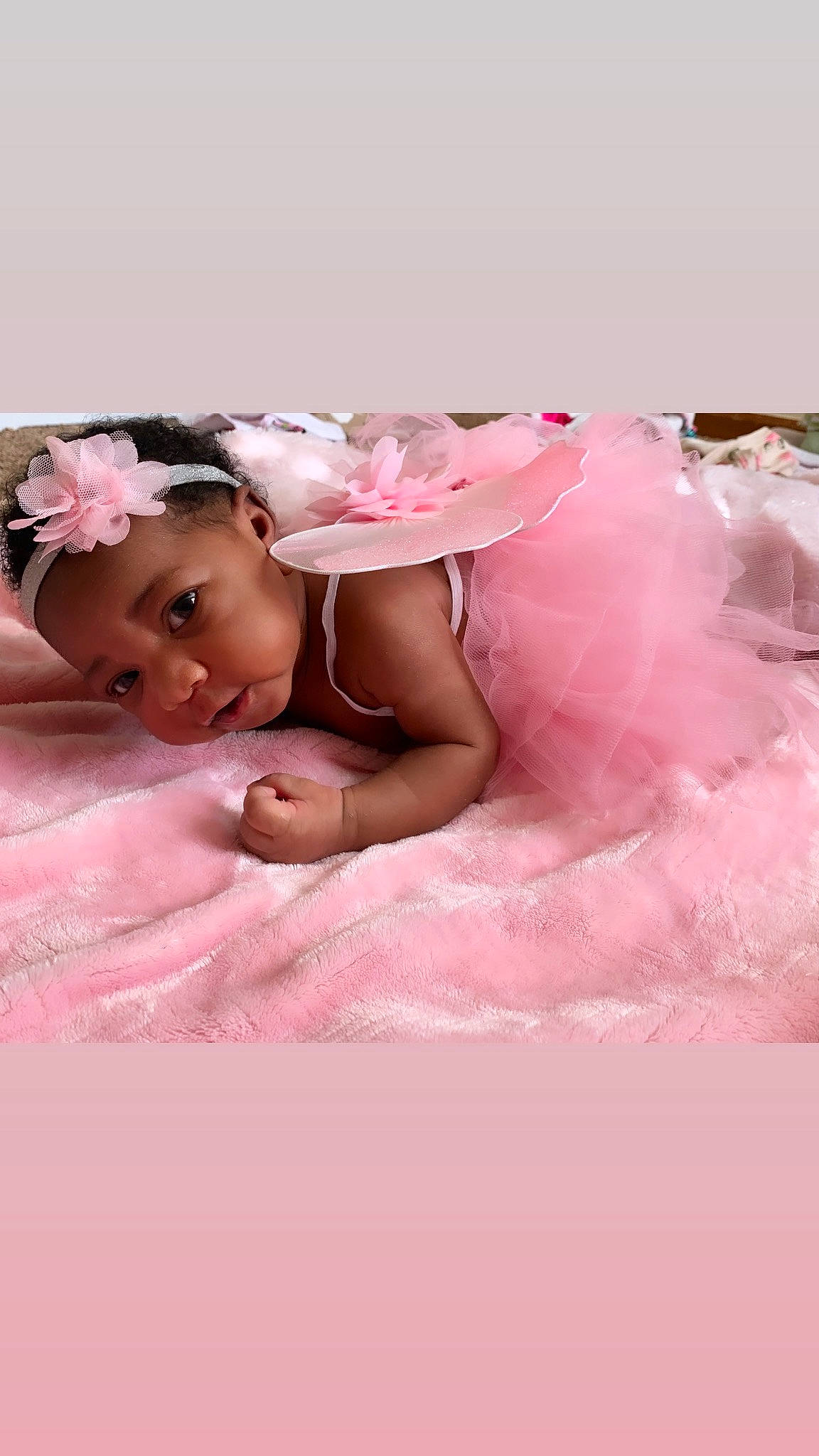 Yemaya is registered to the contest to win money with this photo: baby, child, costume, hair_accessory, headpiece, person, petal, pink, skin, toddler