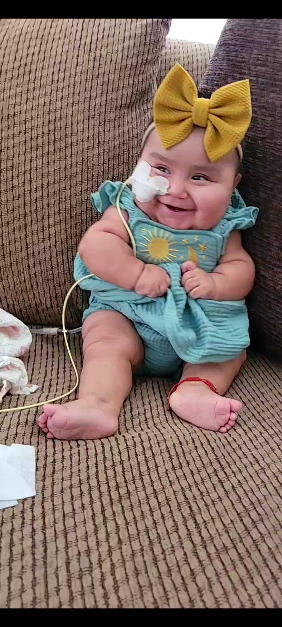 Katalina is registered to the contest to win money with this photo: baby, baby_products, baby_toddler_clothing, cap, cheek, comfort, finger, foot, fun, happy, head, headwear, human_body, human_leg, lap, person, pink, sitting, skin, smile