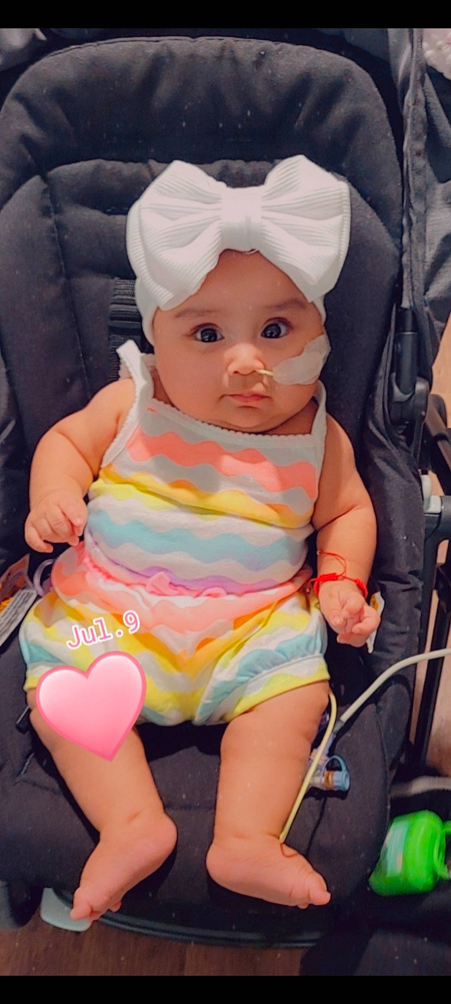 Katalina is registered to the contest to win money with this photo: baby, baby_carriage, baby_products, baby_toddler_clothing, cap, cheek, child, comfort, finger, fun, happy, headwear, human_leg, organ, person, pink, product, sitting, skin, sleeve