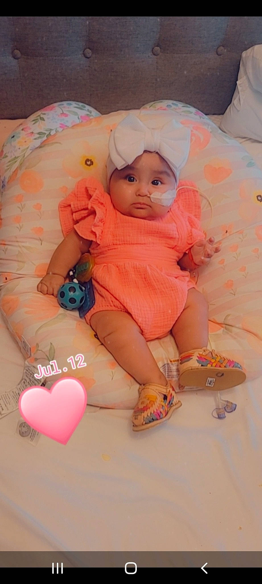 Katalina is registered to the contest to win money with this photo: arm, baby, baby_toddler_clothing, comfort, doll, finger, hand, head, headwear, leg, nail, orange, peach, person, pink, skin, sleeve, stuffed_toy, thigh, thumb