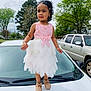 blackhair, car, child, clothing, dress, eveningdress, face, female, formalwear, girl, head, person, photography, portrait, sitting, skirt, sleeve, standing, transportation, vehicle