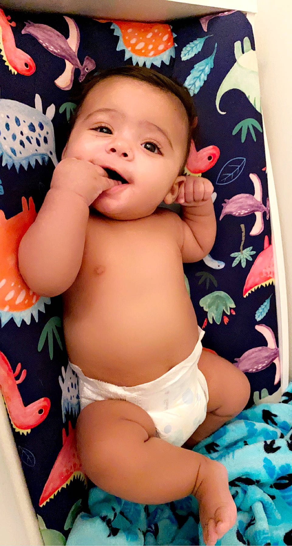 Kyng is registered to the contest to win money with this photo: arm, baby, baby_toddler_clothing, cheek, chest, diaper, eye, face, hand, head, human_body, mouth, neck, organ, person, pink, skin, smile, stomach, textile