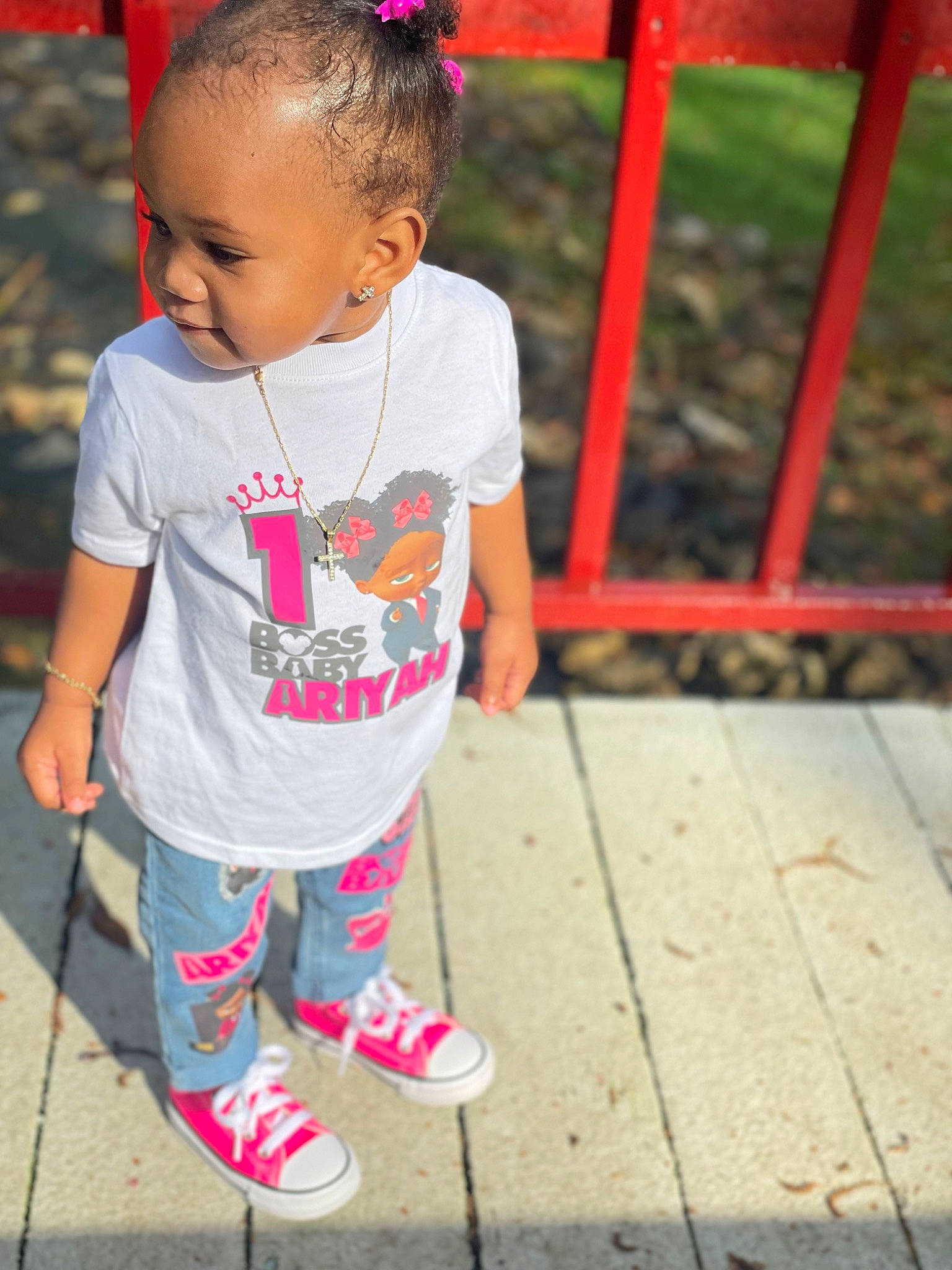 Ariyah is registered to the contest to win money with this photo: baby, baby_toddler_clothing, child, cool, eye, face, fun, grass, hair, hairstyle, happy, human_leg, leisure, magenta, person, pink, plant, recreation, sleeve, t_shirt