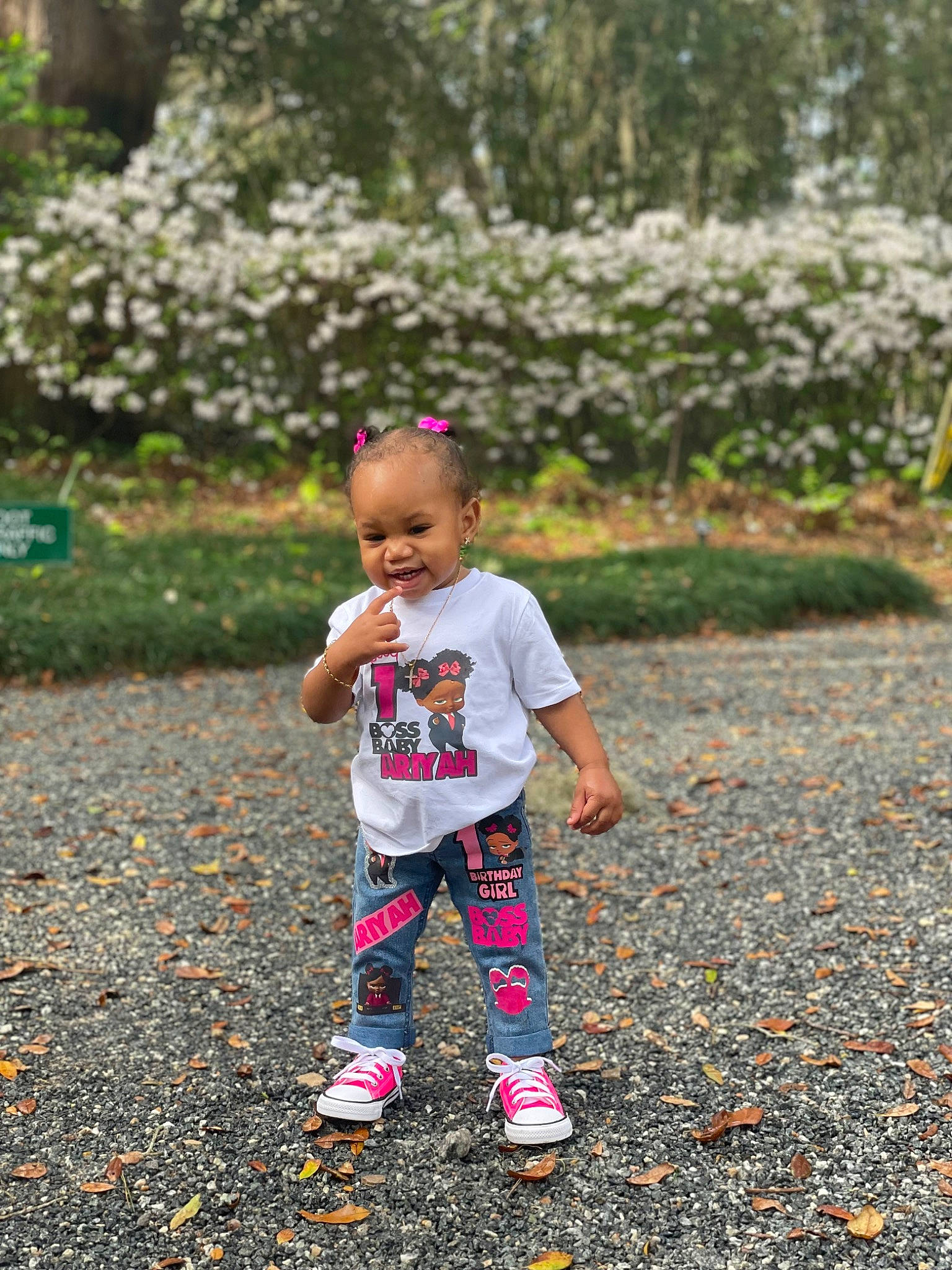 Ariyah is registered to the contest to win money with this photo: asphalt, baby_toddler_clothing, child, flower, fun, garden, grass, happy, landscape, leisure, magenta, people_in_nature, person, pink, plant, recreation, sidewalk, soil, tints_and_shades, toddler