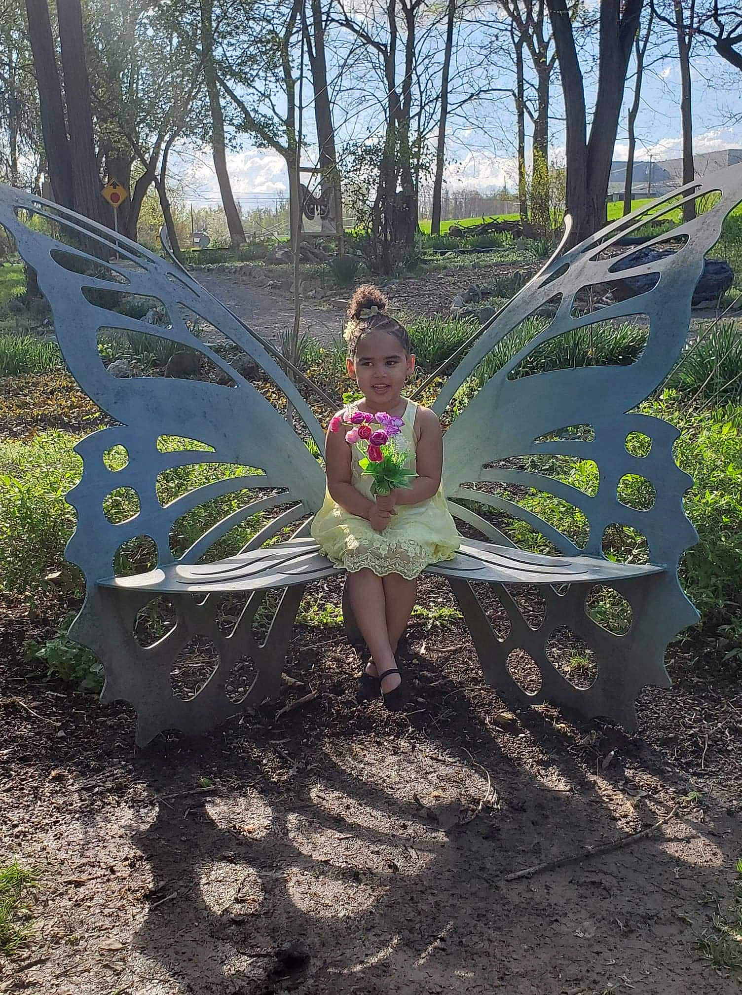 Anna is registered to the contest to win money with this photo: botany, child, dress, fawn, fictional_character, fun, garden, grass, joy, leaf, leisure, person, plant, shrub, spring, summer, tree, woodland, yard