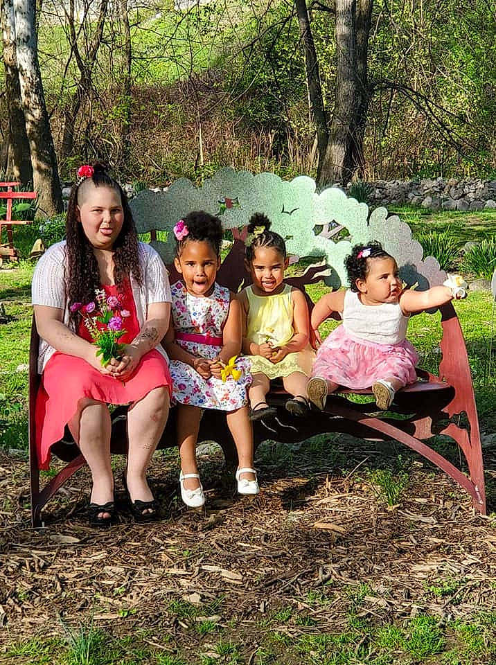 Akilliana is registered to the contest to win money with this photo: adaptation, botany, child, dress, event, family, fawn, fun, grass, happy, joy, leisure, people, person, plant, sitting, smile, tree, vacation, woodland