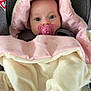 baby, pacifier, blanket, car_seat, pink, cream, star_pattern, child, infant, cute, face, hood, warm, cozy, comfort, clothing, seat, head_support, indoor, portrait