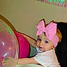 Kensli joined the competition — help win amazing prizes! toddler, child, baby, pink_bow, headband, balloon, confetti, indoor, curious, blue_eyes, smile, white_shirt, celebration, party, decorations, young_child, cute, face, portrait, playing