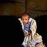 Jackson joined the competition — help win amazing prizes! baby, child, infant, portrait, face, wide_eyed, sitting, blanket, quilt, blue_shirt, couch, indoor, home, furniture, cozy, brown_hair, looking_at_camera, close_up, candid, family_photo