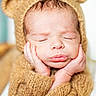 newborn, baby, sleeping, portrait, teddy_bear, costume, hood, ears, hands, face, closed_eyes, peaceful, cozy, blanket, soft, brown, infant, cute, studio_lighting, close_up