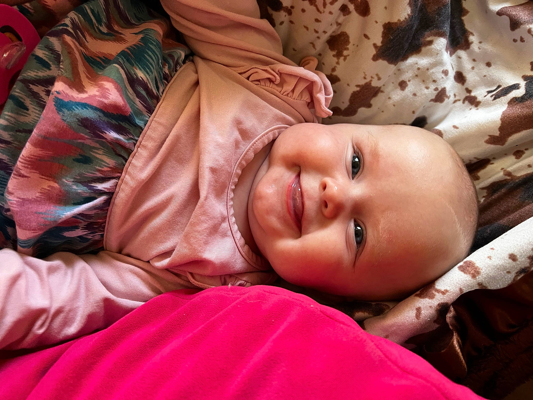 Laken is registered to the contest to win money with this photo: baby, cheek, child, chin, comfort, eye, facial_expression, flash_photography, fun, happy, joy, lip, mouth, nose, orange, person, pink, skin, smile, textile