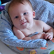 Jessie Schumm Jr joined the competition — help win amazing prizes! baby, infant, blanket, blue_blanket, baby_seat, child, cute, smiling, face, skin, hand, cozy, indoor, patterned, colorful, young_child, portrait, comfort, seated, happy