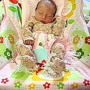 Sylvia is registered to the contest to win money with this photo: newborn, baby, sleeping, onesie, floral_pattern, blanket, baby_rocker, fisher_price, colorful, flower_pattern, infant, cozy, indoors, child, soft, cute, peaceful, resting, baby_clothing, toddler