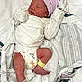 Sylvia is registered to the contest to win money with this photo: newborn, baby, sleeping, hat, diaper, blanket, hospital, infant, clothing, foot, hand, person, bed, soft, cute, wrapped, peaceful, resting, pink