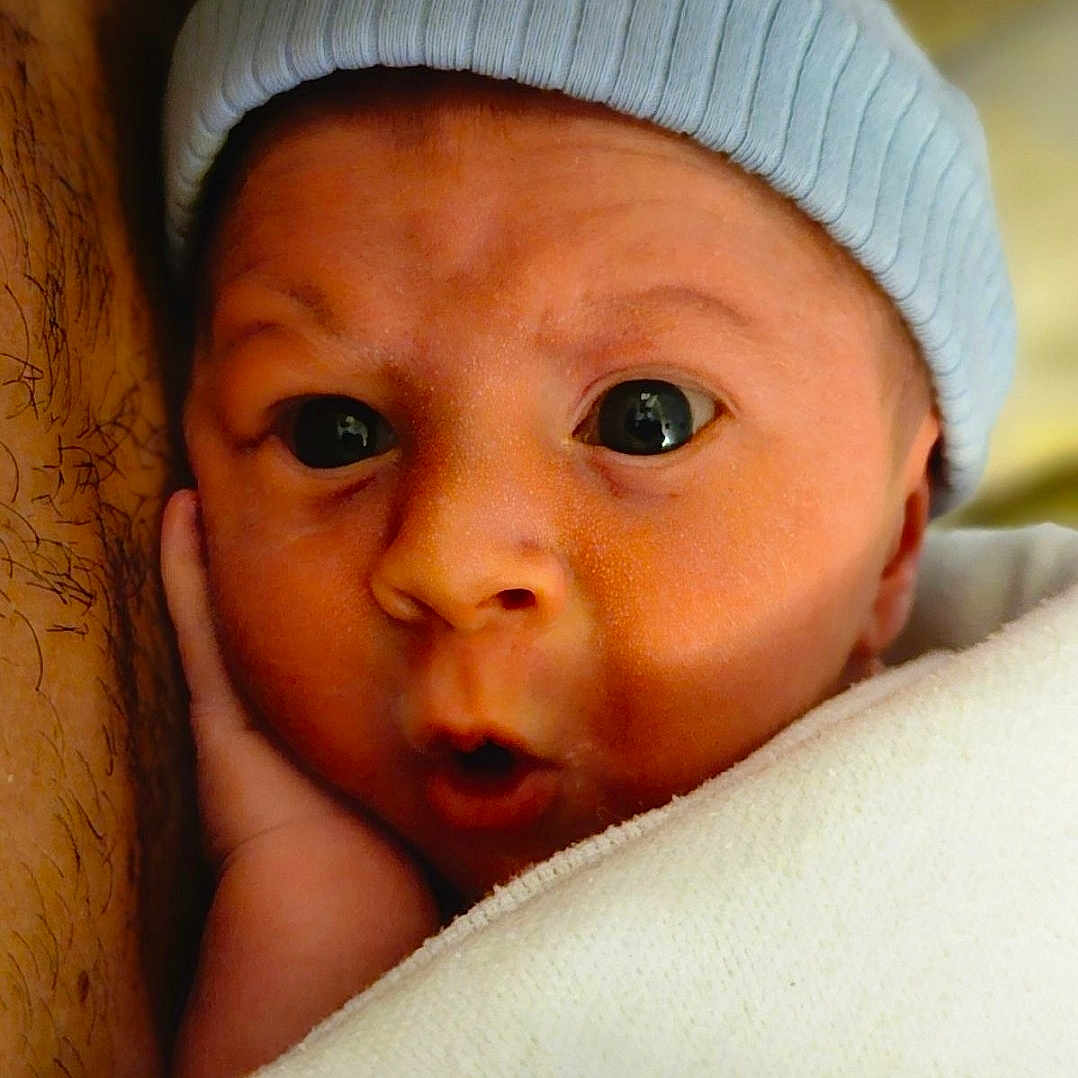 Remi joined the competition — help win amazing prizes! baby, beanie, blanket, bonnet, cap, clothing, face, hat, head, kissing, newborn, person, photography, portrait, romantic