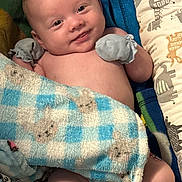 River joined the competition — help win amazing prizes! baby, smiling, blanket, mittens, infant, cute, portrait, lying_down, soft_toys, animal_print, cozy, skin, cheerful, child, comfort, small_hands, cute_face, indoors, fabric, pattern