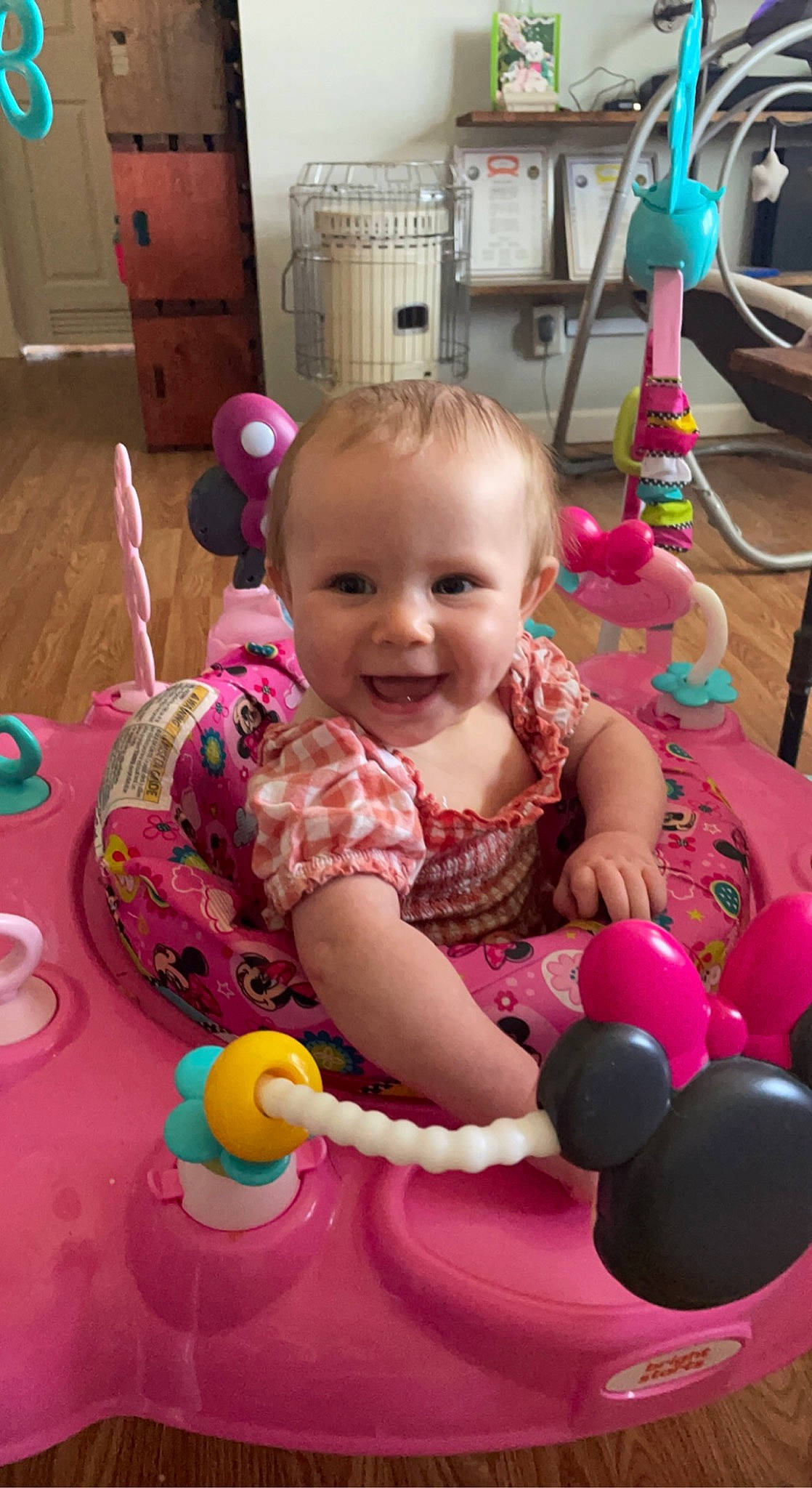 Oakley is registered to the contest to win money with this photo: baby, baby_playing_with_toys, cheek, child, eye, face, facial_expression, fun, happy, head, joy, leisure, mammal, organ, person, pink, product, purple, skin, smile