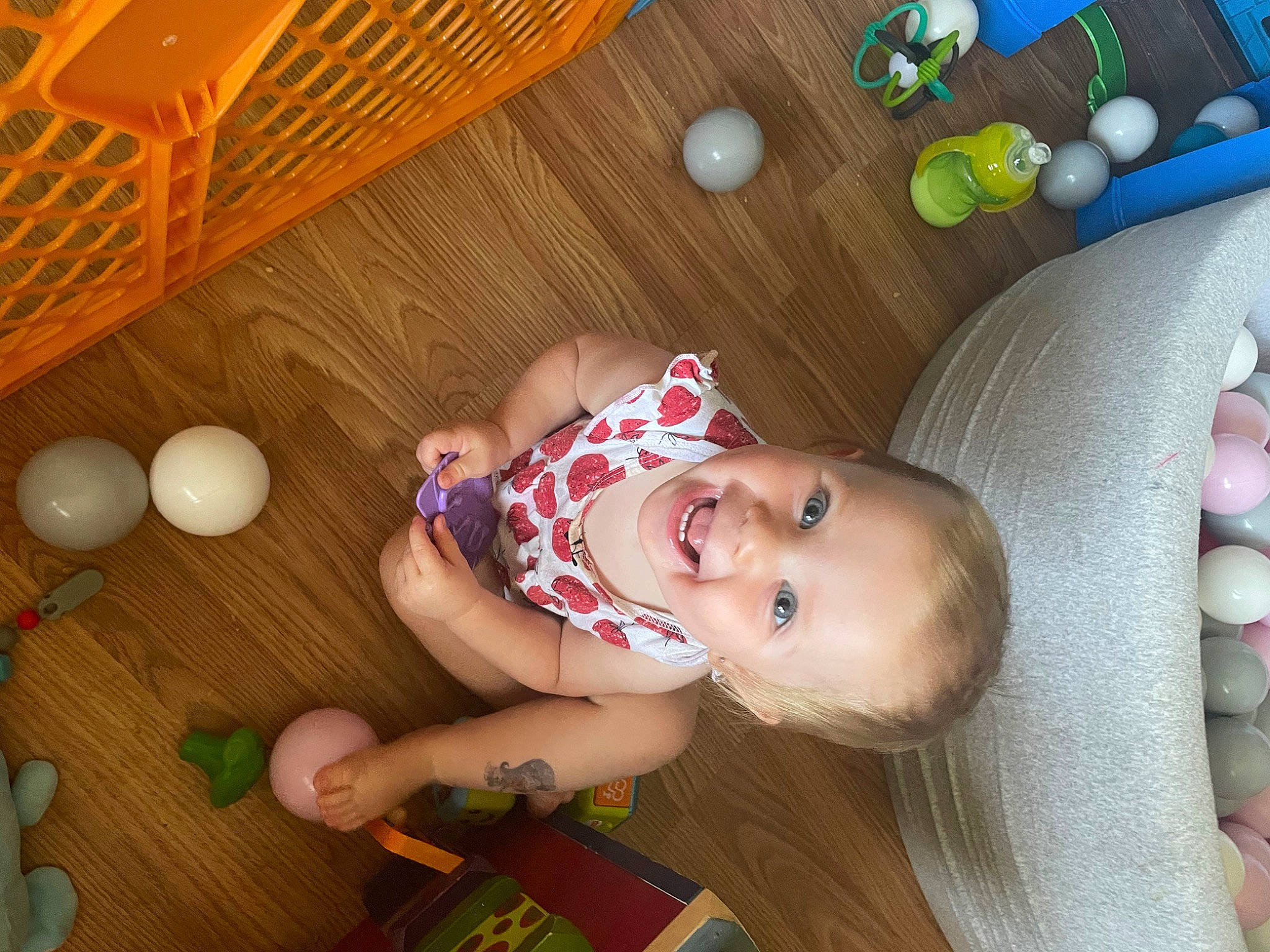 Oakley is registered to the contest to win money with this photo: baby, baby_laughing, baby_products, baby_toddler_clothing, baby_toys, child, flooring, fun, happy, hardwood, joy, leisure, pattern, person, play, room, smile, toddler, toy, wood
