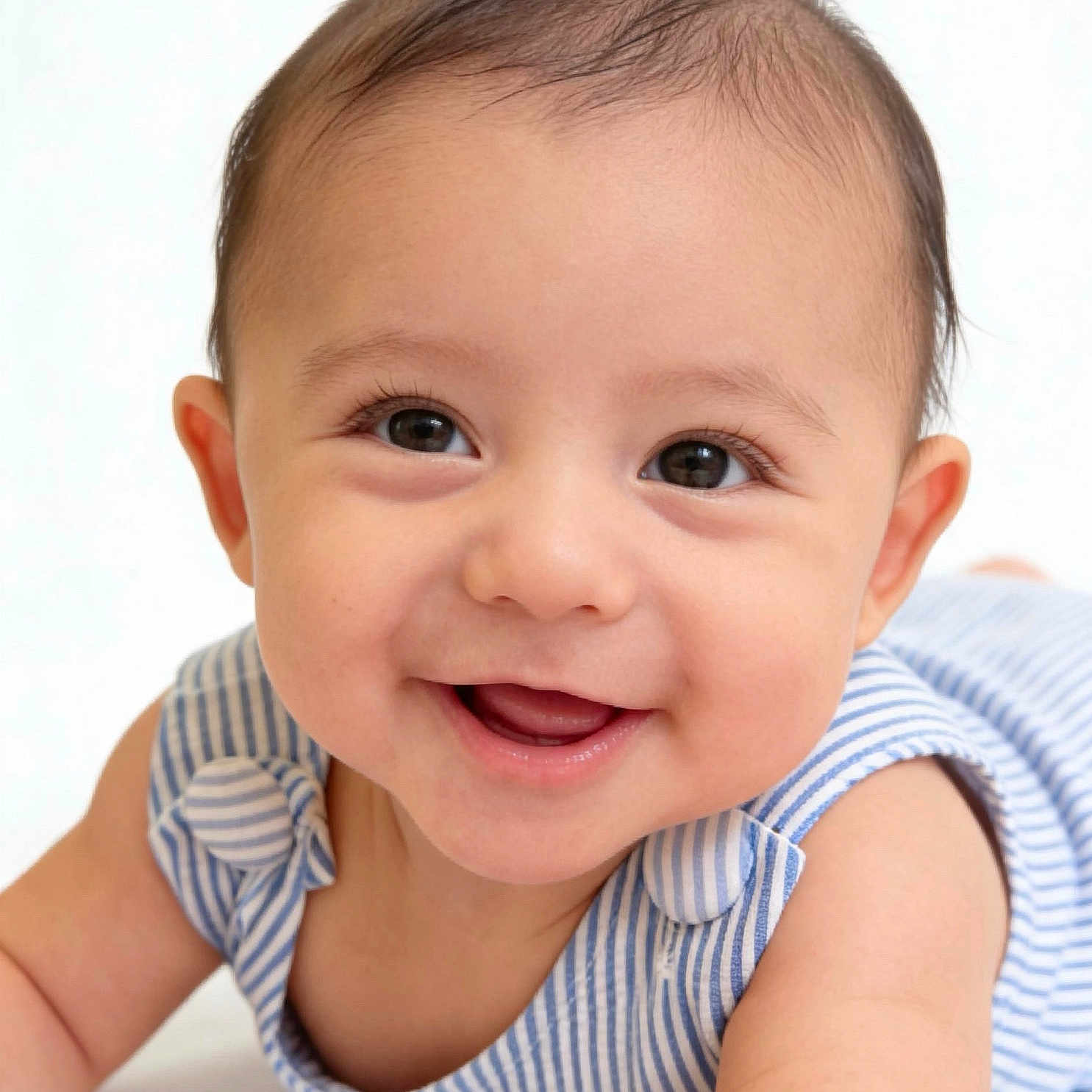 Barron joined the competition — help win amazing prizes! baby, child, infant, smiling, happy, portrait, face, eyes, brown_hair, open_mouth, striped_clothing, blue_clothing, sleeveless_outfit, lying_down, close_up, indoor, bright_background, photography, adorable, gummy_smile