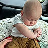 baby, infant, child, car_seat, car_interior, hand, clothing, pants, shirt, bald_head, cute, sitting, holding_hands, support, window, greenery, indoors, seat, portrait, young