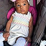 Ailyn joined the competition — help win amazing prizes! baby, child, car_seat, pink, white_dress, headband, bow, knee_socks, cute, curious, infant, seatbelt, child_safety, portrait, indoors, person, clothing, fashion, accessory, young_child