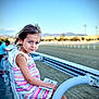 Aria participe au concours pour gagner de l'argent avec cette photo : child, girl, blue_eyes, crocheted_dress, colorful_clothing, sitting, railing, outdoor, daylight, booklet, race_track, metal, curious, person, portrait, casual, summer, young, nature, background_blur