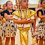 child, children, costume, gold, medal, performance, ceremony, group, indoor, dress, standing, proud, young, event, people, focused, decorative, celebration, team, posing