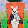 Atticus is registered to the contest to win money with this photo: baby, backdrop, bow_tie, carrot_throne, chair, child, costume, ears, easter_bunny, event_photography, festival, green_decor, holiday, indoor, mascot, person, plush, portrait, seat, smile