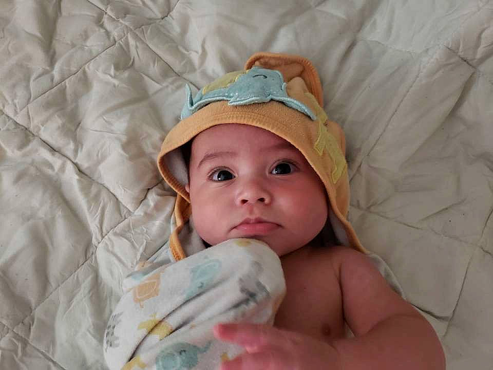 Cayde joined the competition — help win amazing prizes! baby, bedtime, child, headgear, headwear, linens, person, skin, toddler