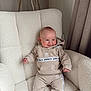 baby, child, smile, hoodie, pants, adidas, tracksuit, armchair, furniture, indoor, curtains, cozy, fashion, comfortable, happy, person, sitting, cute, infant, portrait