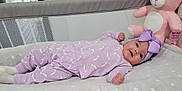 Arabella joined the competition — help win amazing prizes! baby, infant, purple_outfit, headband, bow, blanket, star_pattern, teddy_bear, pink_toy, crib, mesh_sides, soft_toys, sleepwear, lying_down, cute, child, indoor, portrait, adorable, resting