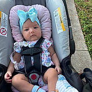 Arabella joined the competition — help win amazing prizes! baby, car_seat, blue_bow, headband, floral_outfit, socks, blanket, infant, child, seatbelt, pink_cushion, outdoor, grass, sidewalk, closeup, portrait, cute, baby_accessories, safety, person
