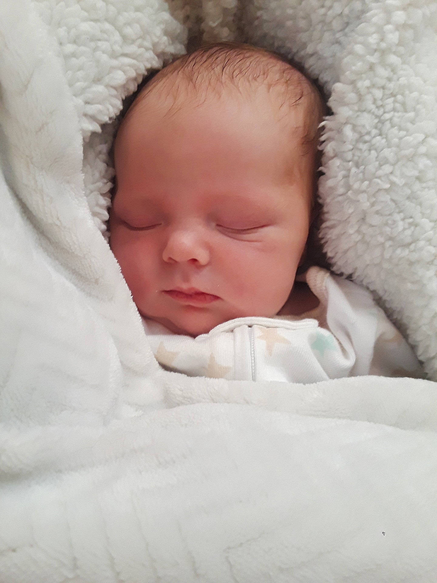 Kennedy is registered to the contest to win money with this photo: bed, bedtime, cheek, child, close_up, girl, hand, infant, lip, nose, person, product, skin, sleep, textile, toddler