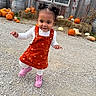 Ayla is registered to the contest to win money with this photo: autumn, barn, child, cute, decoration, fall, festive, gravel, hay_bales, orange_dress, outdoor, pigtails, pink_boots, pumpkin, rustic, seasonal, smiling, toddler, walking, white_shirt