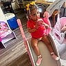 Ayla joined the competition — help win amazing prizes! beverage, bottle, chair, child, cute, drink, expression, flooring, furniture, hair_bows, household, indoor, person, pink, room, slide, socks, table, toddler, toy