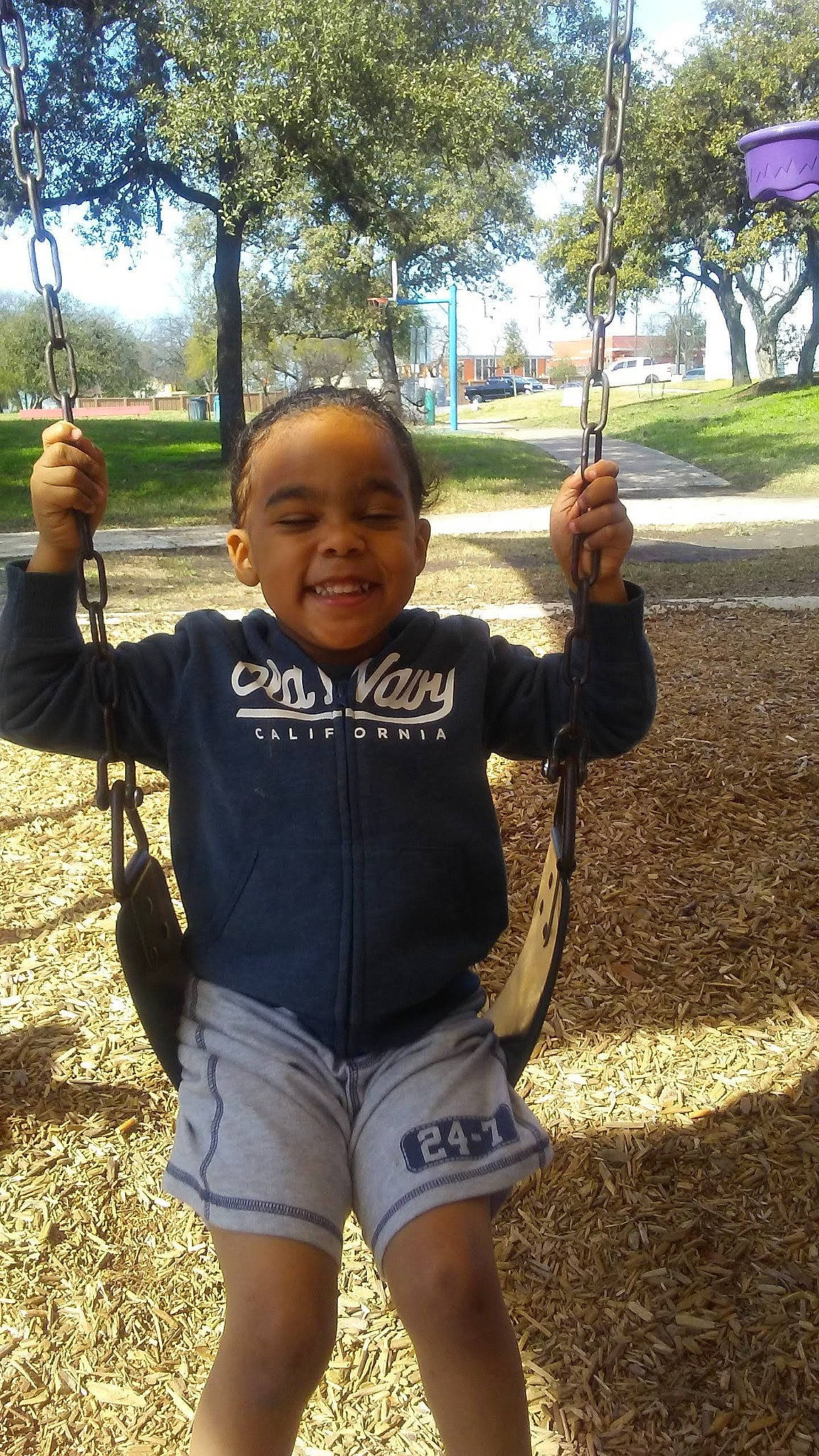 Michaela joined the competition — help win amazing prizes! child, facial_expression, finger, fun, gesture, grass, happy, joy, leaf, leisure, people_in_nature, person, plant, recreation, sky, sleeve, smile, soil, t_shirt, thumb