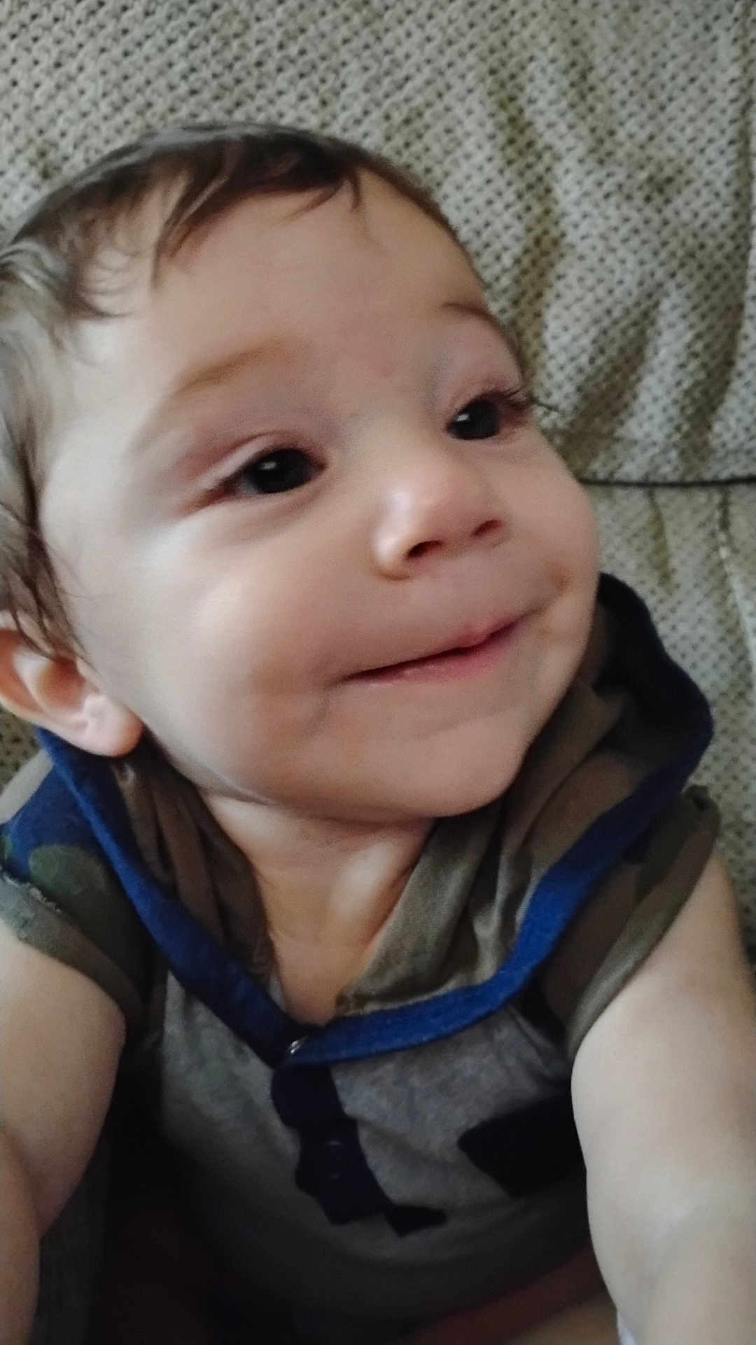 Hunter is registered to the contest to win money with this photo: baby, child, smile, face, hoodie, infant, young_child, portrait, sitting, cute, expression, person, apparel, closeup, skin, indoor, head, eyes, cheeks, happy