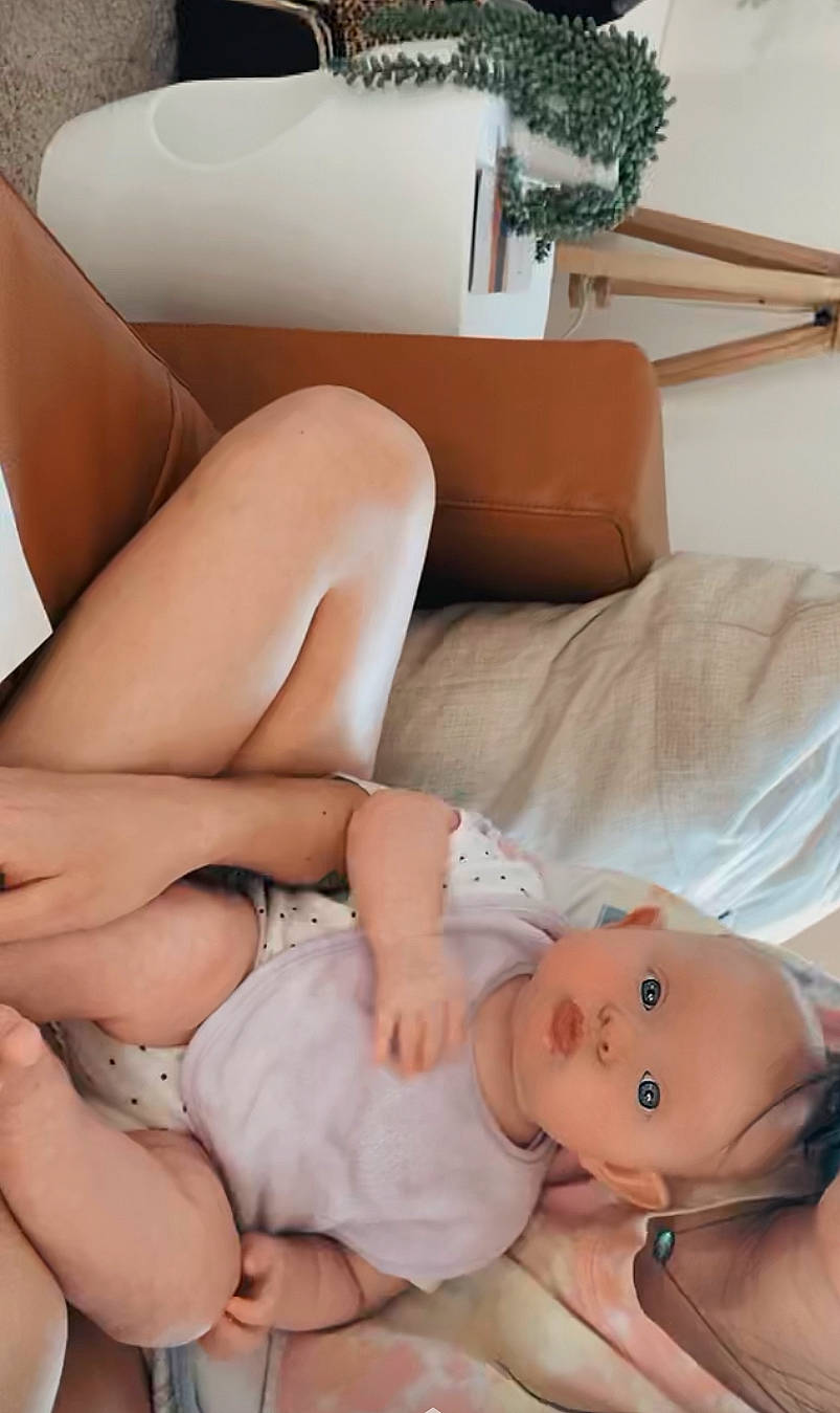 Saige joined the competition — help win amazing prizes! arm, baby, baby_toddler_clothing, chest, comfort, finger, hand, human_body, human_leg, joint, knee, leg, mouth, muscle, person, plant, shoulder, skin, thigh, trunk