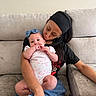 baby, woman, couch, headband, love, affection, indoor, casual_clothing, holding, child, family, portrait, relaxing, home, affectionate, seated, comfort, skin, hair, sitting