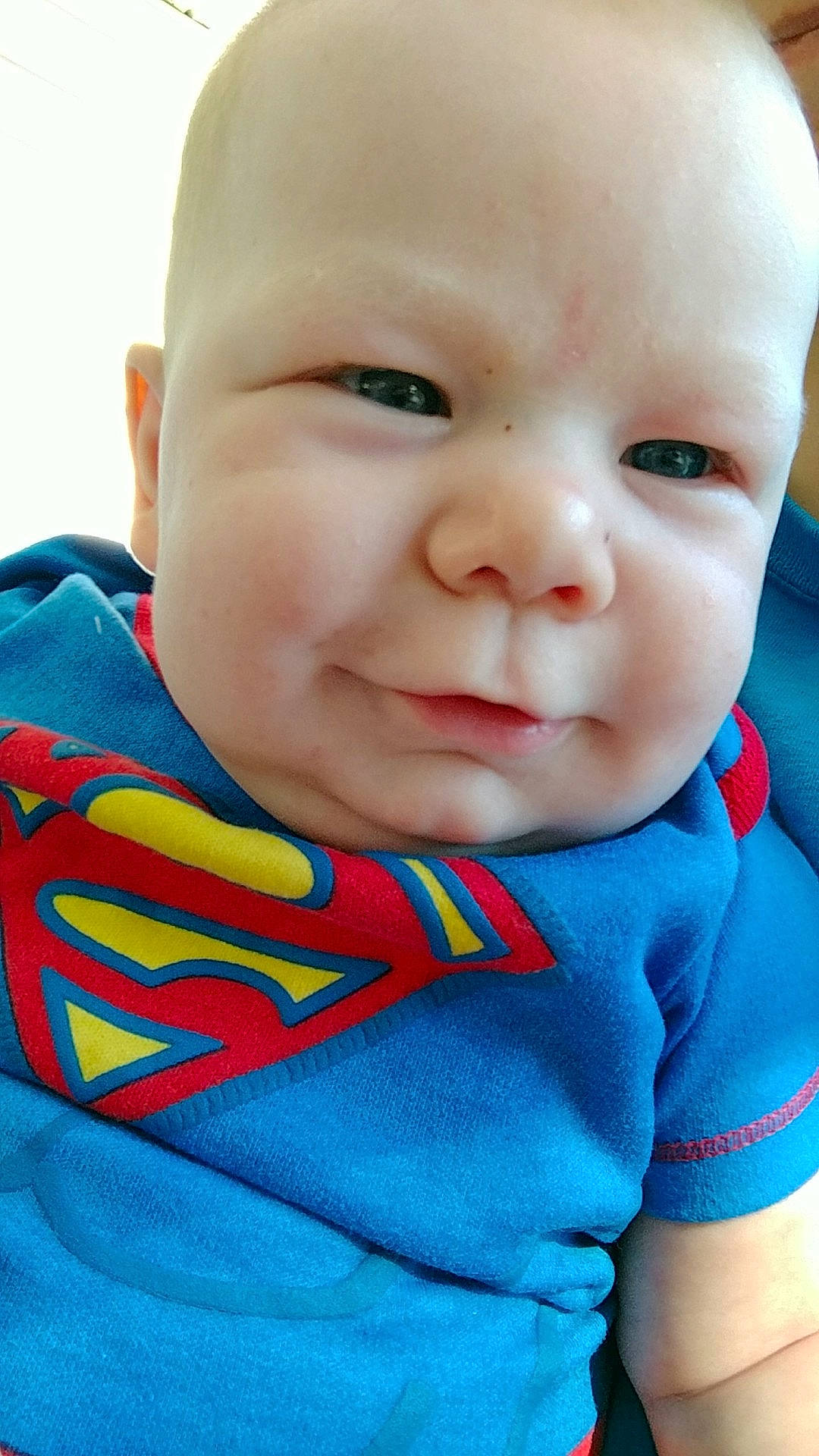 Bentlee is registered to the contest to win money with this photo: blue, boy, cheek, child, chin, close_up, emotion, eye, face, facial_expression, forehead, head, infant, lip, mouth, nose, person, red, skin, smile