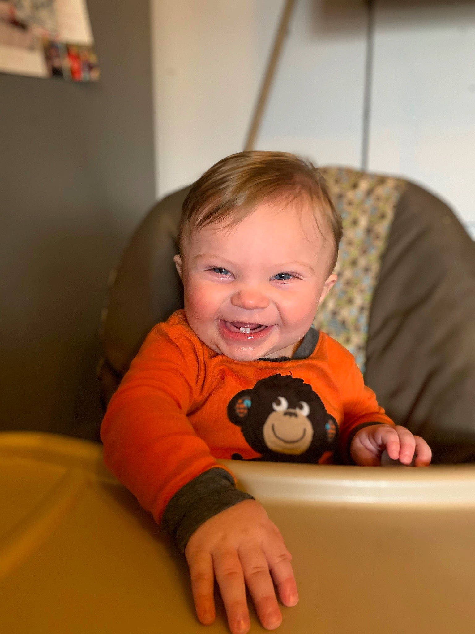 Granger is registered to the contest to win money with this photo: arm, baby, baby_playing_with_toys, baby_toddler_clothing, cheek, comfort, eye, face, finger, fun, hair, happy, head, mouth, orange, person, skin, sleeve, smile, toddler