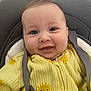 Tiziano a rejoint le concours — aidez-le/la à gagner de superbes lots ! baby, smile, yellow_onesie, sun_print, car_seat, straps, face, infant, cute, happy, child, clothing, apparel, person, young, closeup, indoor, seat, sitting, joyful