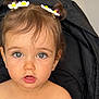 toddler, child, baby, girl, pigtails, hair_clips, daisy, pink_clothing, bow, stroller, black_strap, indoor, curious_expression, blue_eyes, cute, portrait, seatbelt, face, skin, small_earrings