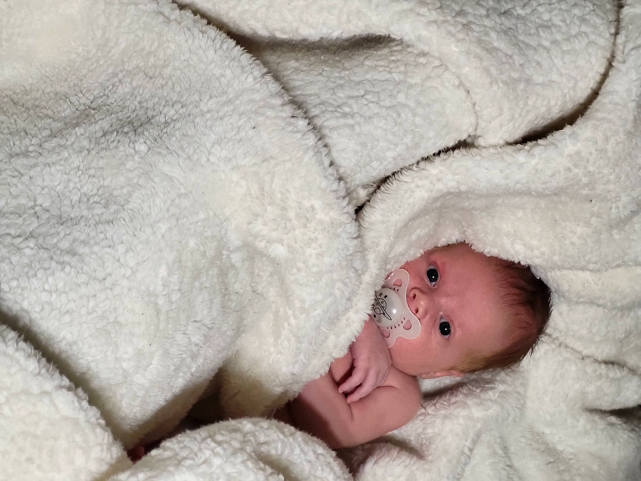 Dylan is registered to the contest to win money with this photo: baby, baby_sleeping, bedding, bedtime, child, comfort, eye, face, fashion_accessory, fur, grey, head, linens, nap, person, skin, teddy_bear, textile, toddler, winter