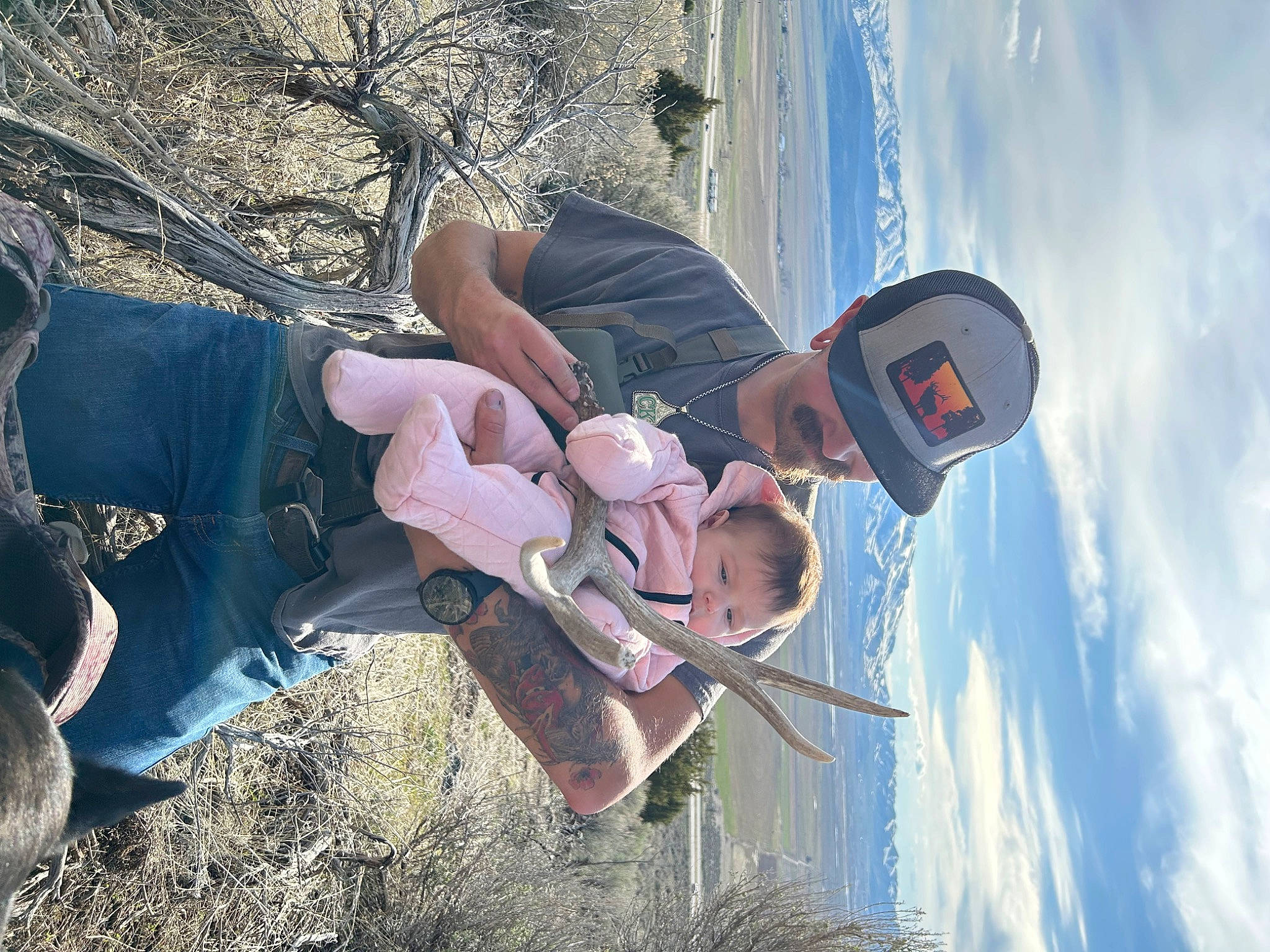 Kinsley is registered to the contest to win money with this photo: adventure, cloud, eyewear, fun, grass, happy, hat, landscape, leisure, person, personal_protective_equipment, plant, recreation, sky, thigh, travel, tree, water