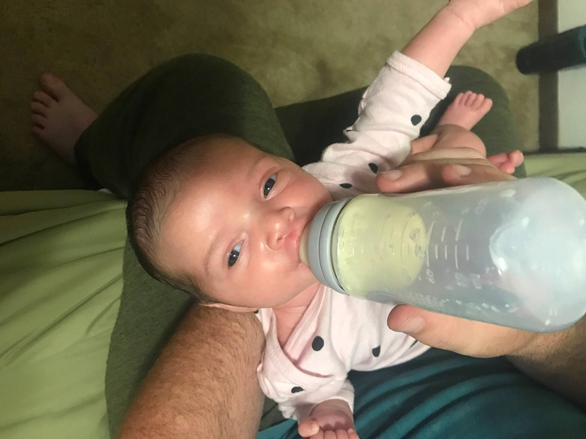 Zelda is registered to the contest to win money with this photo: arm, baby, baby_bottle, baby_products, bottle, child, drink, drinking, drinkware, home_accessories, mouth, muscle, neck, person, plastic_bottle, product, tableware, water